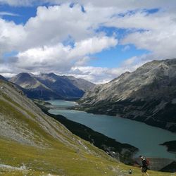 Scenic view of mountains against cloudy sky