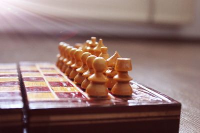 Close-up of chess pieces on table