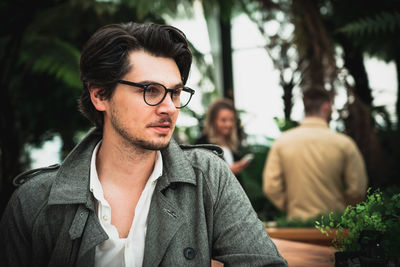 Portrait of young man looking away