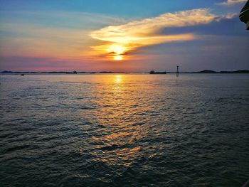 Scenic view of sea against romantic sky at sunset