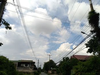 Low angle view of electricity pylon against sky