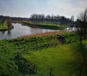 Scenic view of farm against sky