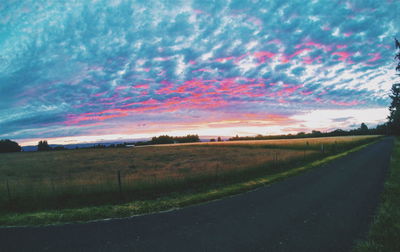 Road passing through field