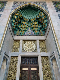 Low angle view of ornate window in building