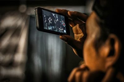 Close-up of man using mobile phone