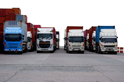 View of vehicles on road against clear sky