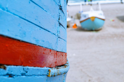 Close-up of boat against blue sky