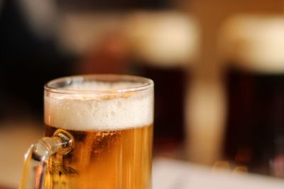 Close-up of beer glass on table