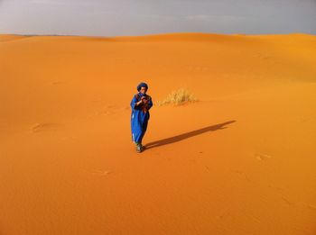 Full length of woman on arid landscape