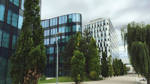 Low angle view of modern buildings against sky