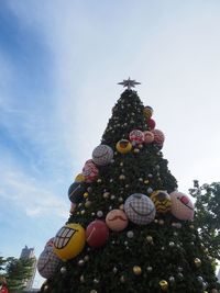 Low angle view of christmas tree against sky