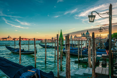 Venetian gondolas at sunset, venice italy.