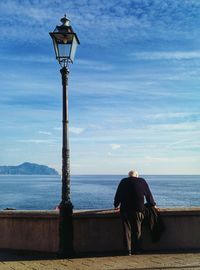 Rear view of woman looking at sea