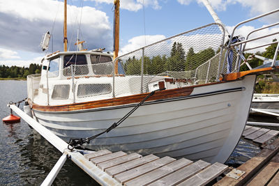 Large sailboat with motor moored at guest harbor