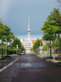 Street amidst buildings against sky