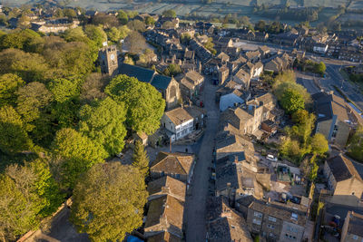 High angle view of trees and buildings in town