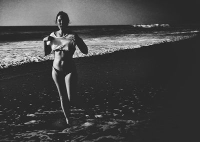 Woman standing on beach