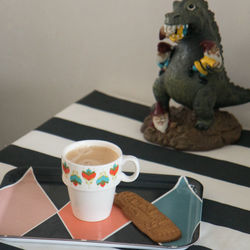 Close-up of coffee cup on table