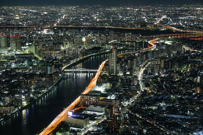 Night aerial panorama of illuminated tokyo with sumida river and bridges