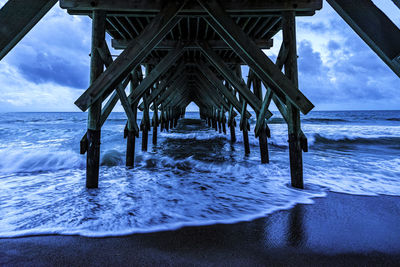 Pier over sea against sky