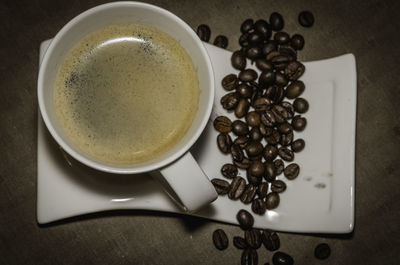 High angle view of coffee cup on table