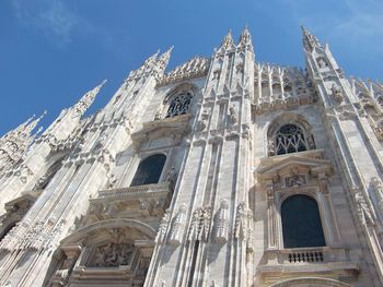 Low angle view of cathedral against blue sky