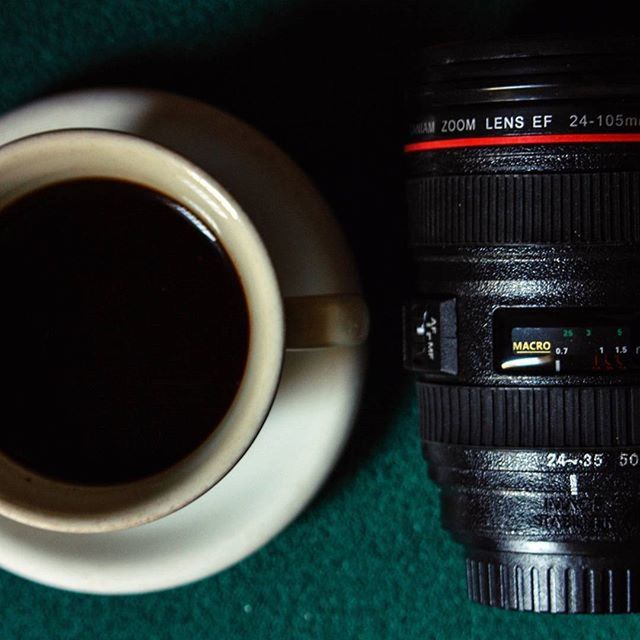 indoors, drink, coffee cup, close-up, refreshment, table, communication, technology, food and drink, coffee - drink, still life, cup, coffee, text, no people, reflection, western script, focus on foreground, high angle view, illuminated