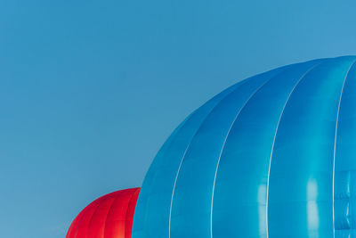 Close-up of hot air balloon against clear blue sky
