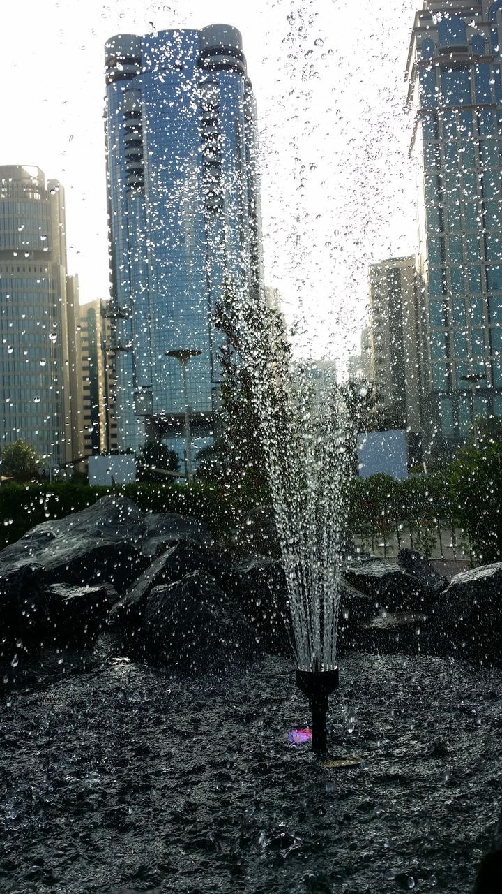 wet, rain, season, weather, water, drop, building exterior, window, monsoon, raindrop, architecture, built structure, car, street, rainy season, glass - material, transparent, rainy, city, tree