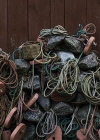 Close-up of fishing net hanging on rope