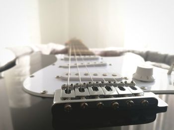 Close-up of guitar at home