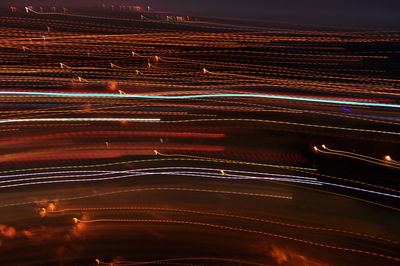 Close-up of illuminated city against sky