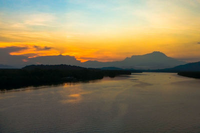 Scenic view of lake against sky during sunset