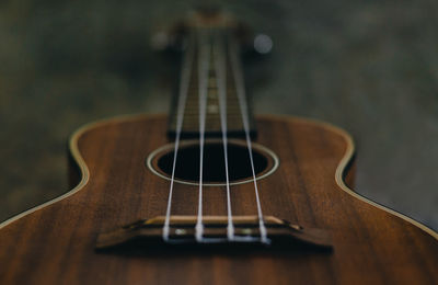 Close-up of guitar on table