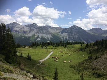 Scenic view of landscape and mountains against sky