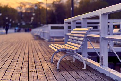 Empty chairs and table against trees