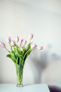 Mother day mockup tulip flowers. minimal banner mockup with lilac tulip flowers on white table and