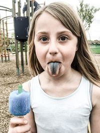 Portrait of mid adult woman holding ice cream