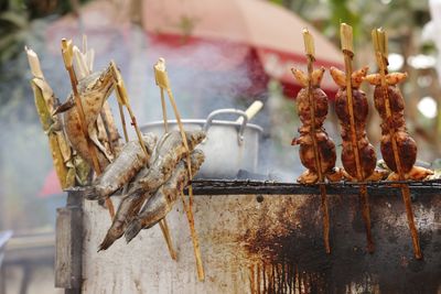 Close-up of meat on barbecue grill