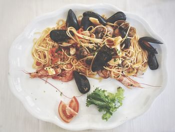 High angle view of spaghetti seafood served in plate