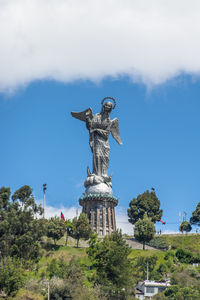 Low angle view of statue against sky