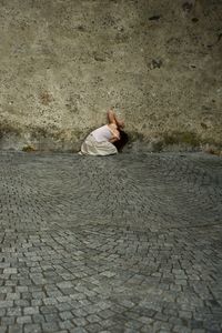 High angle view of girl on footpath