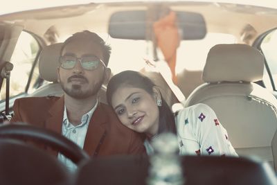 Portrait of people sitting in car