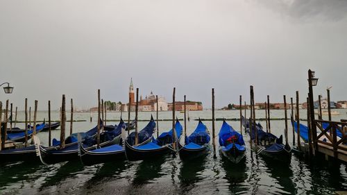 Boats in grand canal against clear sky