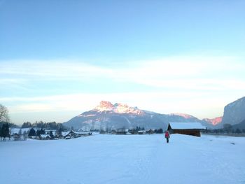 Scenic view of frozen mountain against sky