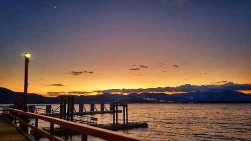 Scenic view of sea against clear sky during sunset