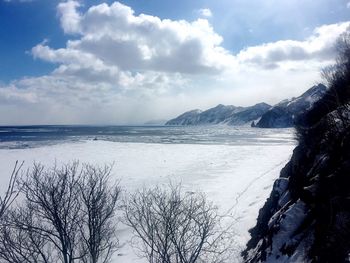 Scenic view of sea against sky during winter