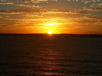 Scenic view of sunset over river