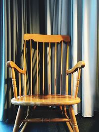 Close-up of empty chair on table at home