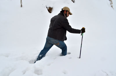 Full length of man standing on snow